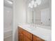 Bright bathroom featuring a light countertop, wood cabinets, and shower at 2020 Dawnshire Dr, Gastonia, NC 28054