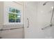 Bathroom shower featuring a window and grab bars for safety and accessibility at 2020 Dawnshire Dr, Gastonia, NC 28054