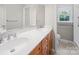 Bathroom featuring a double sink with a light countertop and wood cabinets at 2020 Dawnshire Dr, Gastonia, NC 28054