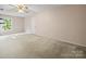 Bedroom with carpeted flooring, ceiling fan, and a large window at 2020 Dawnshire Dr, Gastonia, NC 28054