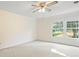 Neutral bedroom with carpet, ceiling fan, and bright windows with outside view at 2020 Dawnshire Dr, Gastonia, NC 28054