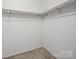 A walk in closet with carpeted floors and shelving at 2020 Dawnshire Dr, Gastonia, NC 28054