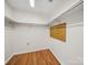 Walk-in closet with wood floors and storage organizers at 2020 Dawnshire Dr, Gastonia, NC 28054
