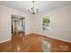 Elegant dining room features hardwood floors, a chair rail, and large windows at 2020 Dawnshire Dr, Gastonia, NC 28054
