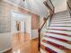 Welcoming foyer with beautiful hardwood floors and staircase showcasing the home's elegant design at 2020 Dawnshire Dr, Gastonia, NC 28054