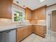 The bright kitchen features stainless steel appliances, tile backsplash, and wood cabinets at 2020 Dawnshire Dr, Gastonia, NC 28054