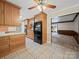Well-equipped kitchen with wood cabinets, modern appliances, tile flooring and an open layout at 2020 Dawnshire Dr, Gastonia, NC 28054