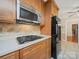 Contemporary kitchen featuring stainless steel appliances and wood cabinetry at 2020 Dawnshire Dr, Gastonia, NC 28054
