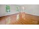 Inviting living room boasts gleaming hardwood floors and two windows offering natural light at 2020 Dawnshire Dr, Gastonia, NC 28054