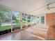 Bright sun room with floor-to-ceiling windows and hardwood floors at 2020 Dawnshire Dr, Gastonia, NC 28054