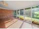 Sun room with floor-to-ceiling windows and hardwood floors at 2020 Dawnshire Dr, Gastonia, NC 28054