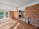 Sun room with brick accent wall and hardwood floors at 2020 Dawnshire Dr, Gastonia, NC 28054