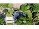 Aerial view showcasing the property's roof, driveway, lush landscaping, and backyard at 2333 Greenland Ave, Charlotte, NC 28208