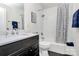Clean bathroom with a shower-tub combo, modern fixtures, and stylish shower curtain at 2333 Greenland Ave, Charlotte, NC 28208