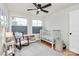Bright bedroom featuring hardwood floors, dual windows, and a cozy atmosphere with a crib and rocking chair at 2333 Greenland Ave, Charlotte, NC 28208