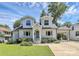 Charming two-story home with a painted brick exterior, dormers, and attached carport at 2333 Greenland Ave, Charlotte, NC 28208