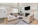 Cozy living room with a fireplace, large windows, and comfortable seating at 2333 Greenland Ave, Charlotte, NC 28208