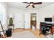 Inviting office space with hardwood floors, natural light, and view into adjoining living room at 2333 Greenland Ave, Charlotte, NC 28208