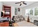 This office features a sofa, desk, shelves, a guitar, and an area rug at 2333 Greenland Ave, Charlotte, NC 28208