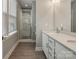 Bright bathroom featuring a double sink vanity and glass-enclosed shower at 2969 Simpson Dr, Charlotte, NC 28205