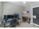 Bedroom featuring two desks, neutral carpeting, a ceiling fan and ample lighting at 2969 Simpson Dr, Charlotte, NC 28205