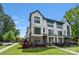 Charming townhome featuring modern design, beautiful landscaping, and a well-maintained lawn at 2969 Simpson Dr, Charlotte, NC 28205
