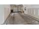 Spacious garage with concrete floor, white walls, and an automatic door provides secure parking and ample storage space at 2969 Simpson Dr, Charlotte, NC 28205