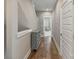 Hallway with hardwood floors and a cabinet for storage on display at 2969 Simpson Dr, Charlotte, NC 28205