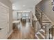 Hallway with beautiful hardwood floors that provide seamless transition to dining room and kitchen at 2969 Simpson Dr, Charlotte, NC 28205