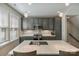 Kitchen featuring grey cabinetry, stainless steel appliances, quartz countertops, and pendant lights at 2969 Simpson Dr, Charlotte, NC 28205