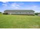 Expansive backyard featuring a vast lawn with a long horizontal home at 308 Laurel Ridge Dr, Lincolnton, NC 28092