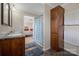 Bathroom with a double sink vanity, tiled floors, and a view into the bedroom at 308 Laurel Ridge Dr, Lincolnton, NC 28092