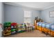 Bedroom with blue walls, toys, and a desk creating a vibrant and playful space at 308 Laurel Ridge Dr, Lincolnton, NC 28092