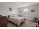 Bedroom with a patterned bedspread, natural light, and a cozy atmosphere at 308 Laurel Ridge Dr, Lincolnton, NC 28092