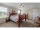 Bright bedroom featuring neutral walls, a ceiling fan, and a rustic wooden bed frame at 308 Laurel Ridge Dr, Lincolnton, NC 28092