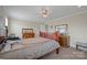 Spacious bedroom with hardwood floors, a comfortable bed, and a traditional dresser for ample storage at 308 Laurel Ridge Dr, Lincolnton, NC 28092