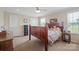 Cozy bedroom with a wooden bed frame, ample natural light, and plenty of closet space at 308 Laurel Ridge Dr, Lincolnton, NC 28092
