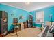This room boasts creative teal walls, natural light, and space perfect for a music studio or hobby room at 308 Laurel Ridge Dr, Lincolnton, NC 28092