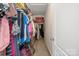 Walk-in closet with clothes and suitcases on shelves, providing ample storage space at 308 Laurel Ridge Dr, Lincolnton, NC 28092