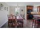 Traditional dining area featuring a large wooden table, natural light, and seamless flow to the kitchen at 308 Laurel Ridge Dr, Lincolnton, NC 28092