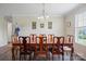 Elegant dining room featuring a wooden table, chairs, and a classic chandelier, ideal for Gathering gatherings at 308 Laurel Ridge Dr, Lincolnton, NC 28092