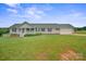 Charming single-story home features a welcoming front porch and attached two-car garage, set on a large landscaped lawn at 308 Laurel Ridge Dr, Lincolnton, NC 28092