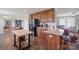 Well-organized kitchen with wooden cabinets, an island table, and a black refrigerator at 308 Laurel Ridge Dr, Lincolnton, NC 28092