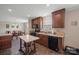 Well-lit kitchen featuring wooden cabinets, modern appliances, and a convenient island, great for cooking at 308 Laurel Ridge Dr, Lincolnton, NC 28092