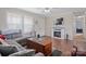 Comfortable living room with hardwood floors, a decorative fireplace, and natural light at 308 Laurel Ridge Dr, Lincolnton, NC 28092