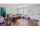 Bright living room with hardwood floors, large windows, a comfortable sofa, and a neutral color scheme at 308 Laurel Ridge Dr, Lincolnton, NC 28092