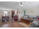 Open-concept living area with dining table, sofa, hardwood floors, and a kitchen visible in background at 308 Laurel Ridge Dr, Lincolnton, NC 28092