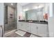 Sleek bathroom with a walk-in shower, dual vanity, and modern fixtures for a spa-like experience at 327 S Turner Ave, Charlotte, NC 28208