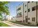 Chic townhome showcasing a private balcony, stylish architecture, and a well-maintained front yard with trees at 327 S Turner Ave, Charlotte, NC 28208
