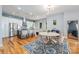 Bright, open kitchen with stainless steel appliances, an island with barstool seating, and a stylish dining area at 327 S Turner Ave, Charlotte, NC 28208